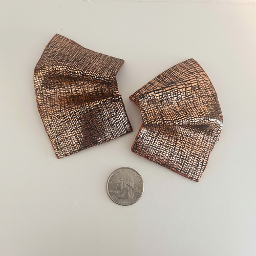 Copper fan earrings with coin on white background