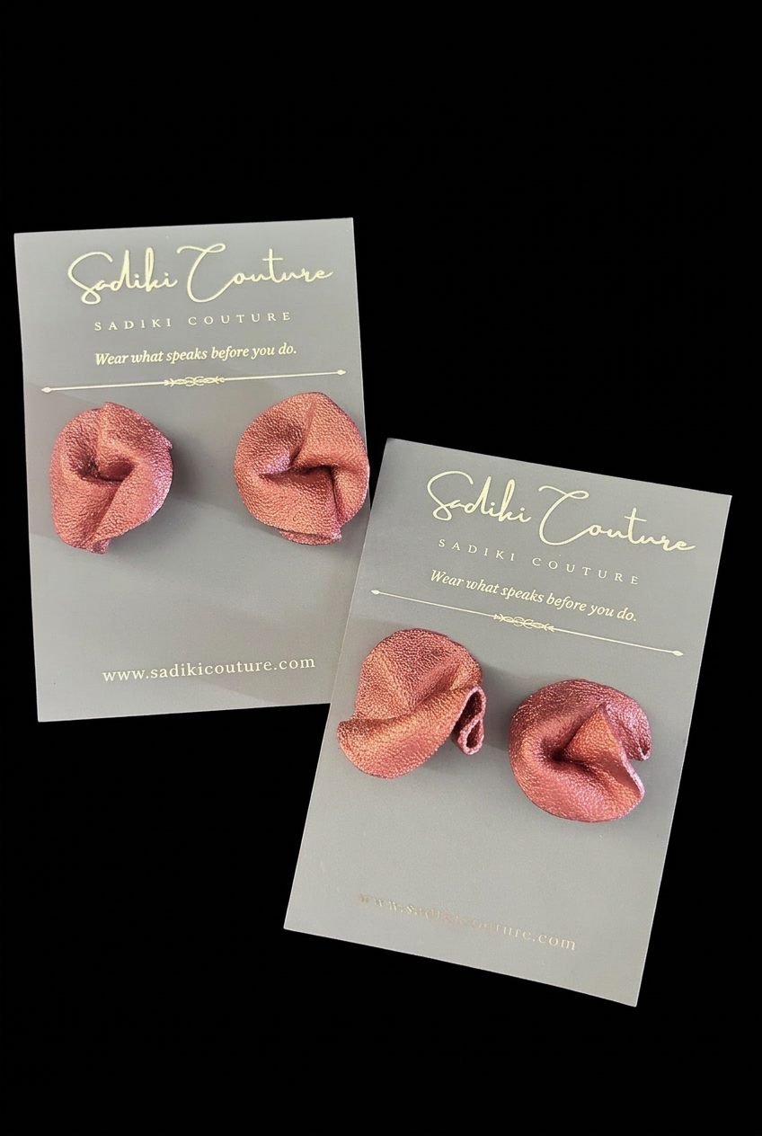 Earrings and display cards on a black background