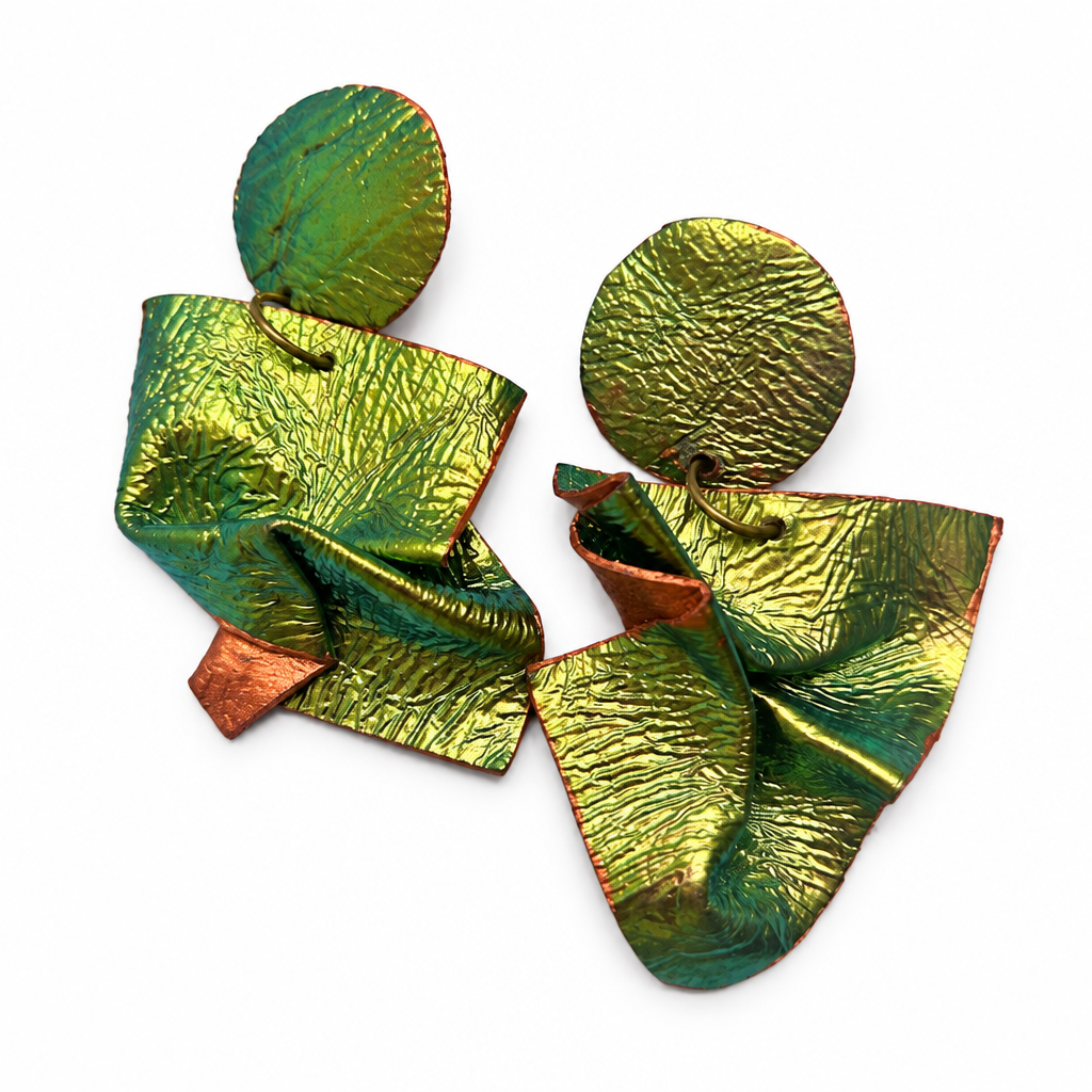 Metallic Muse earrings on a bright white background